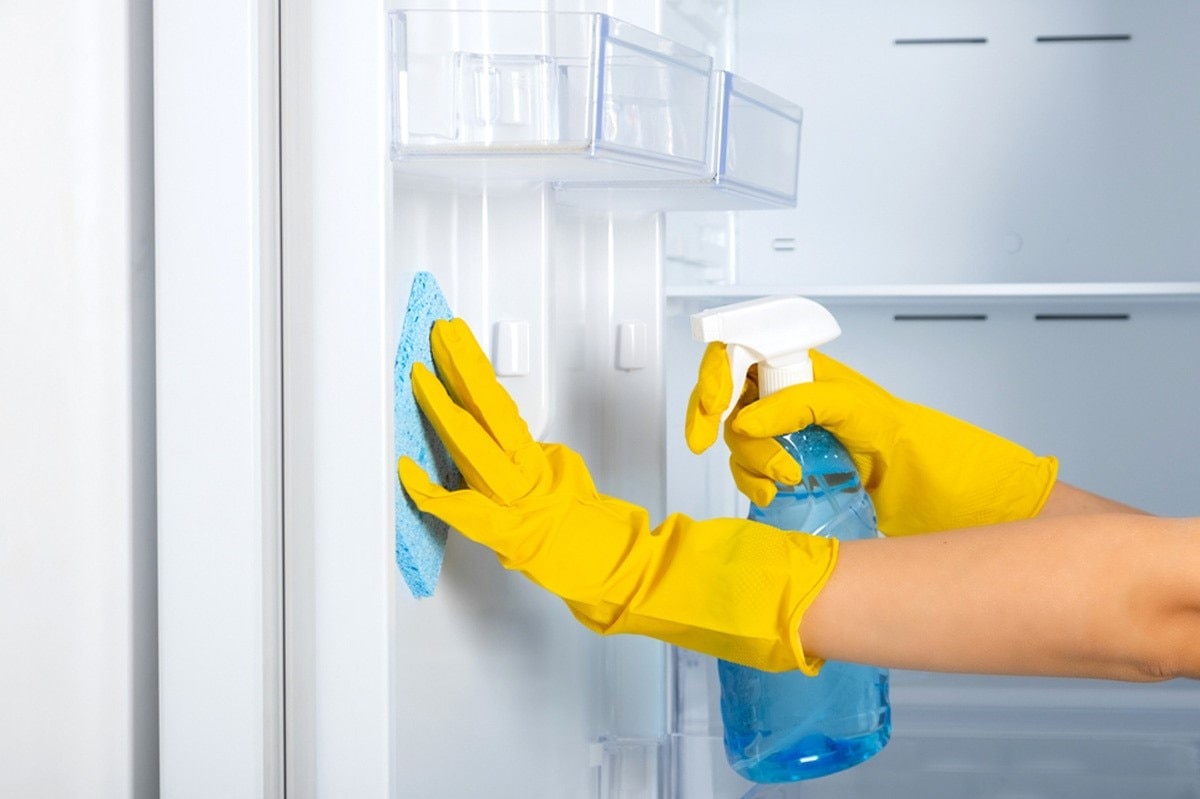 Clean inside of fridge thoroughly with a damp microfiber cloth